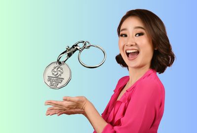 A lady is excited about using custom shopping cart tokens for promotional branding.