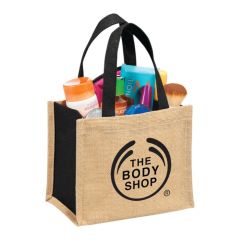 A custom branded mini jute gift tote filled with swag and printed with a black logo.