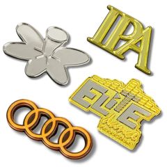 Three moulded and polished custom metal lapel pins in different metal finish options and one lapel pin badge back.