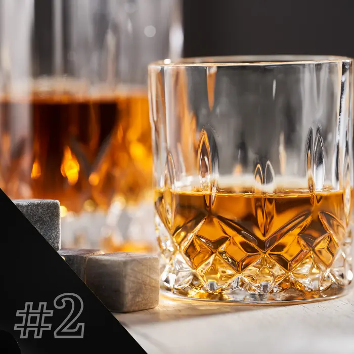  An On the Rocks whiskey glass beside reusable whiskey ice cubes.