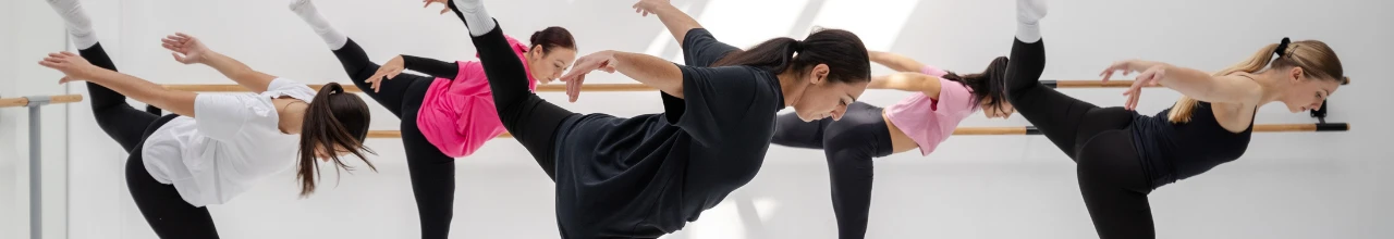 Women dancing for fitness at a dance class in Hamilton while wearing custom apparel.