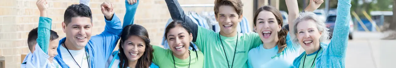 Volunteers working at a non-profit in Edmonton to fundraise while wearing lanyards and custom T-shirts.